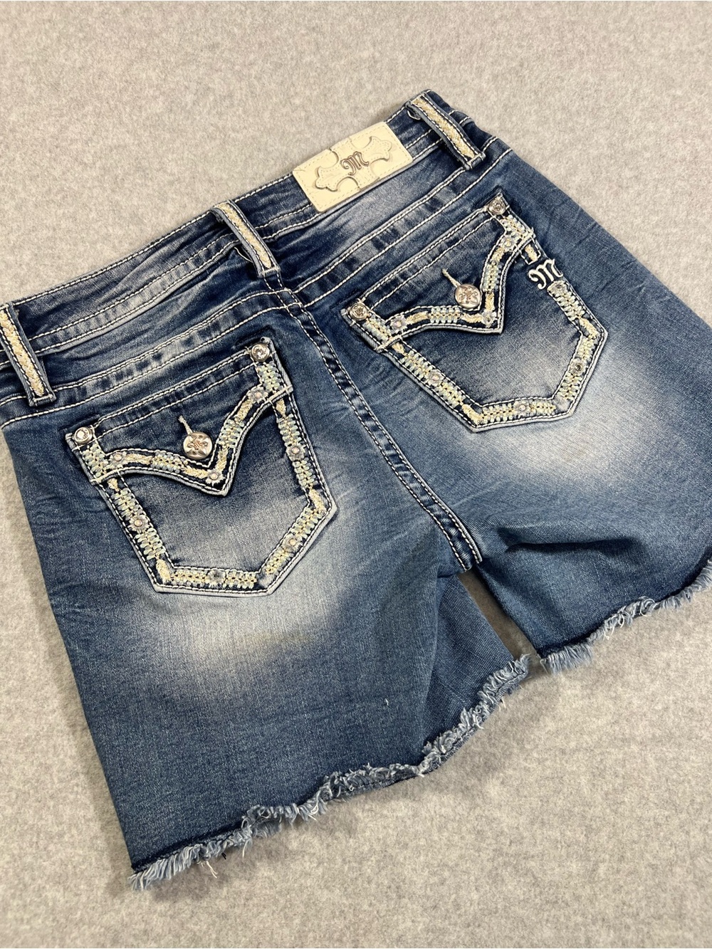 Miss Me Denim Mid-Rise Frayed Hem Shorts in Faded Blue